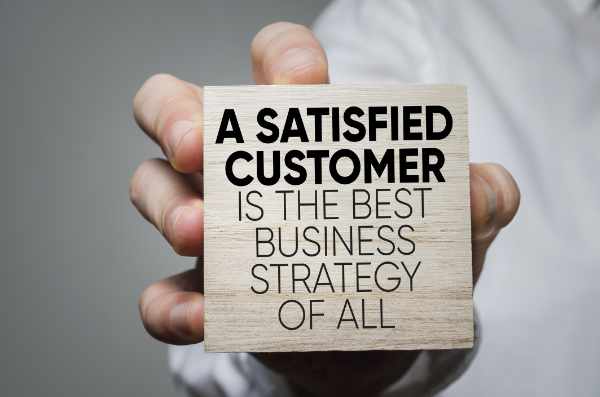Attorney hand holding sign about clients